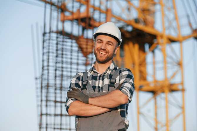 happy-worker-is-standing-on-the-construction-site-2023-01-19-04-17-50-utc.jpg