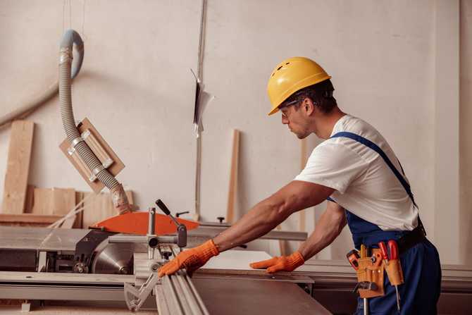 male-builder-using-woodworking-machine-in-workshop-2022-01-04-23-26-19-utc.jpg
