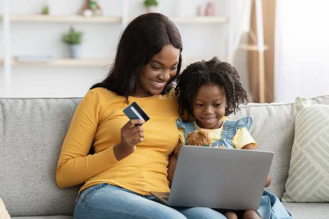 happy-black-mother-and-daughter-shopping-online-wi-2023-11-27-05-10-29-utc (1).jpg