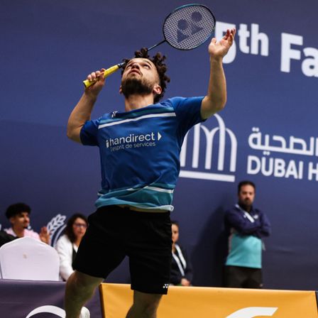 Charles Noakes in action during a para badminton match at the Dubai Para Badminton Championships.