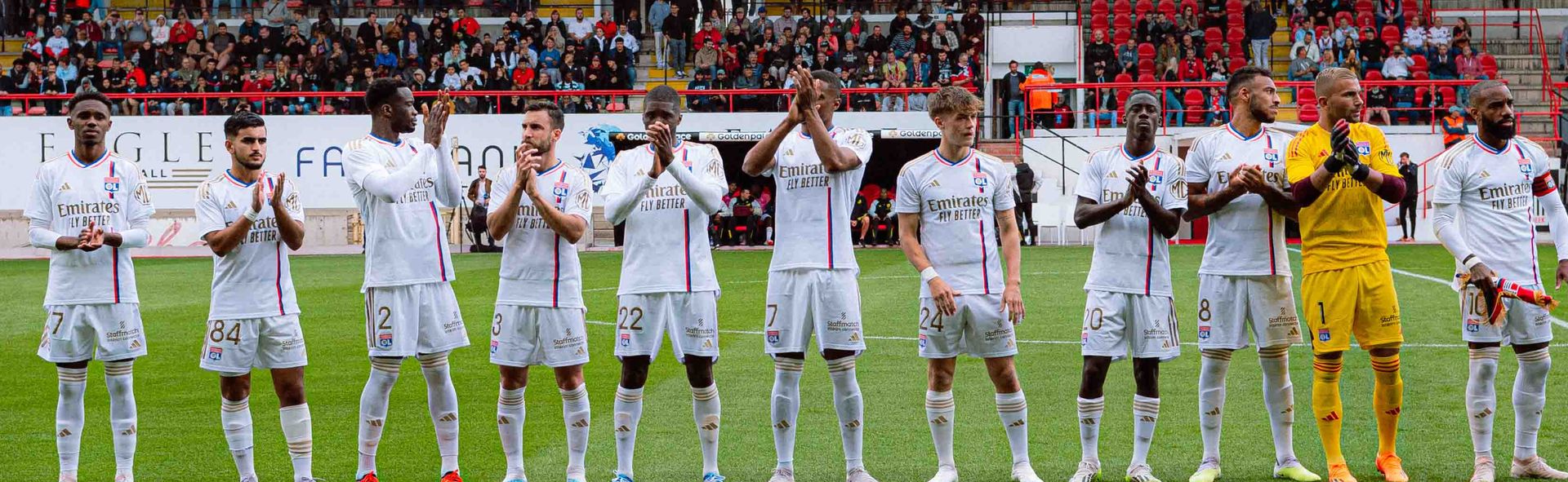 The OL team applauding its supporters.