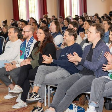 Members of the Staffmatch team applauding during the annual seminar plenary.